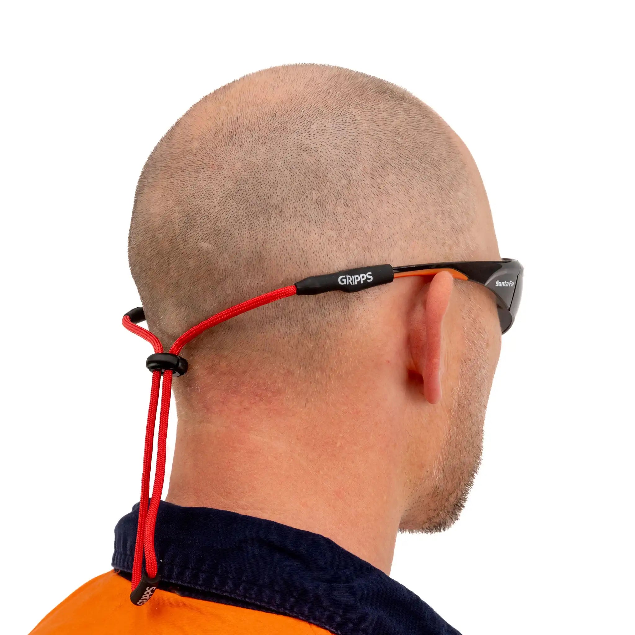 A worker at height using the GRIPPS® Safety Glasses Tether MKII to keep protective eyewear secured.